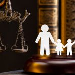 Paper cut of of two parent holding hands with two children and a statue of Lady Justice | Alternative Dispute Resolution in Family Law