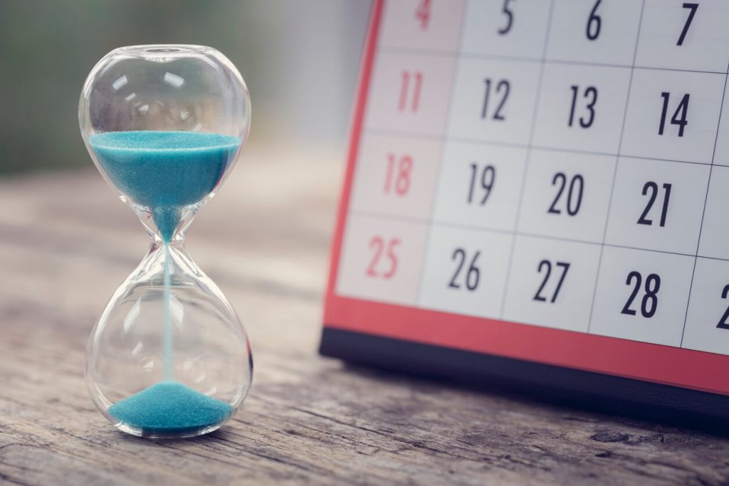 Hour glass and calendar concept for time slipping away for important appointment date, schedule and deadline | A Brief Overview of Limitation Periods in Ontario